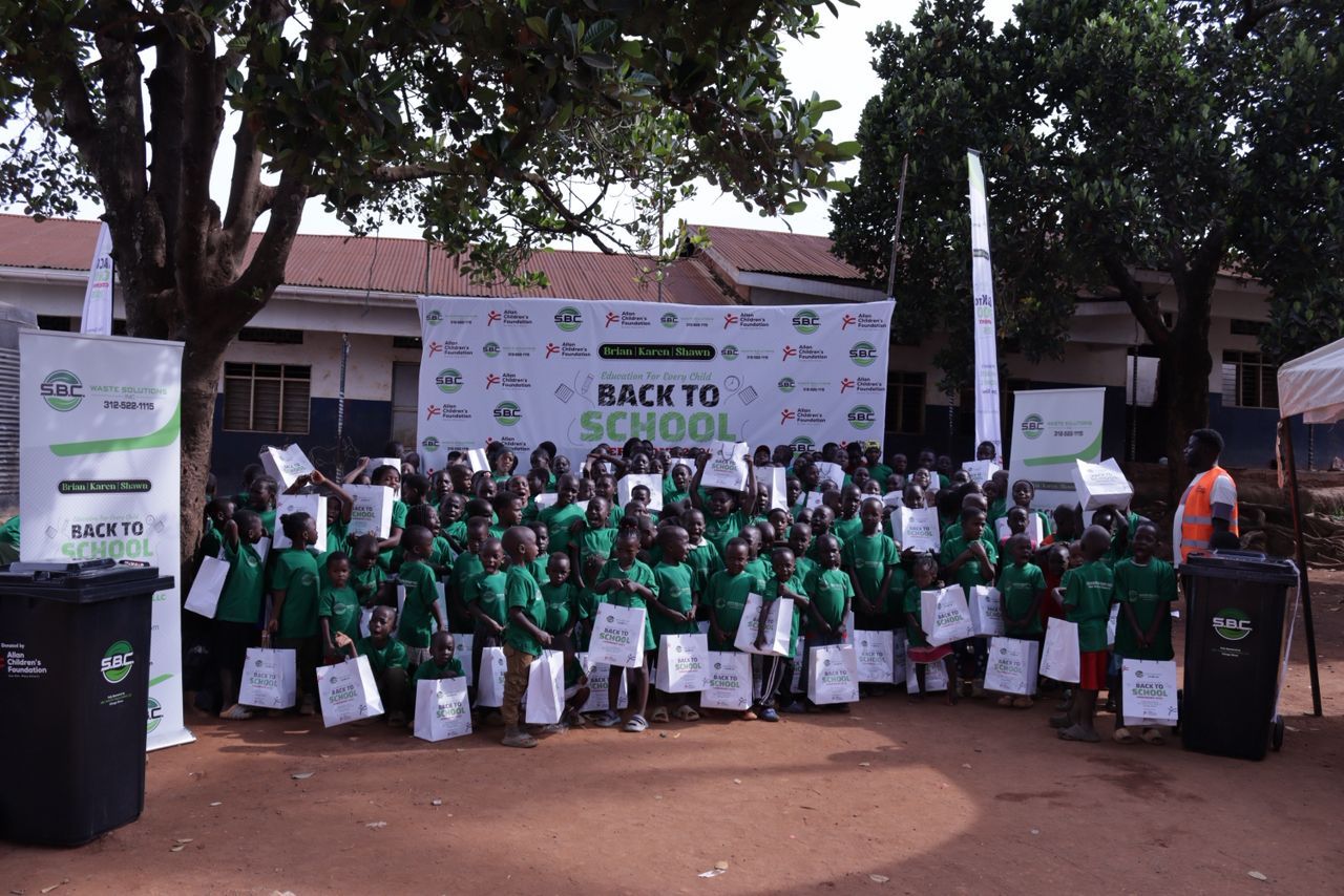 Children in green t-shirts celebrating