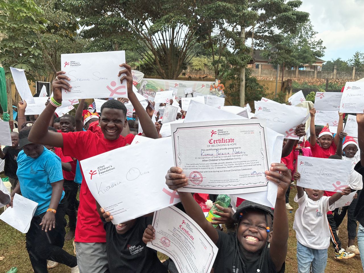 Allan presenting certificate to child