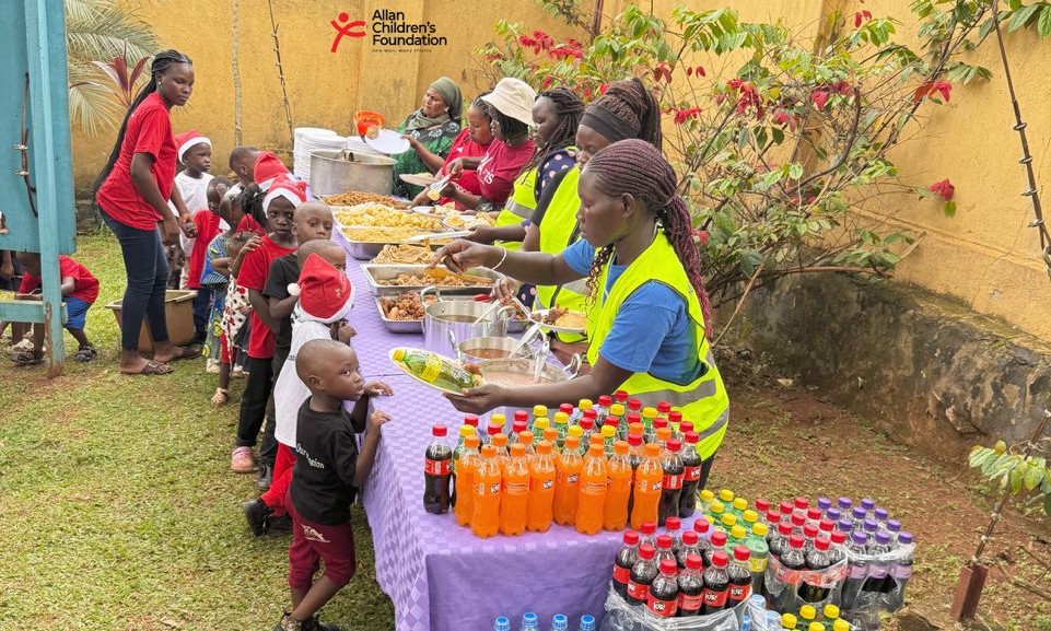 Child happily enjoying Christmas meal with a big smile
