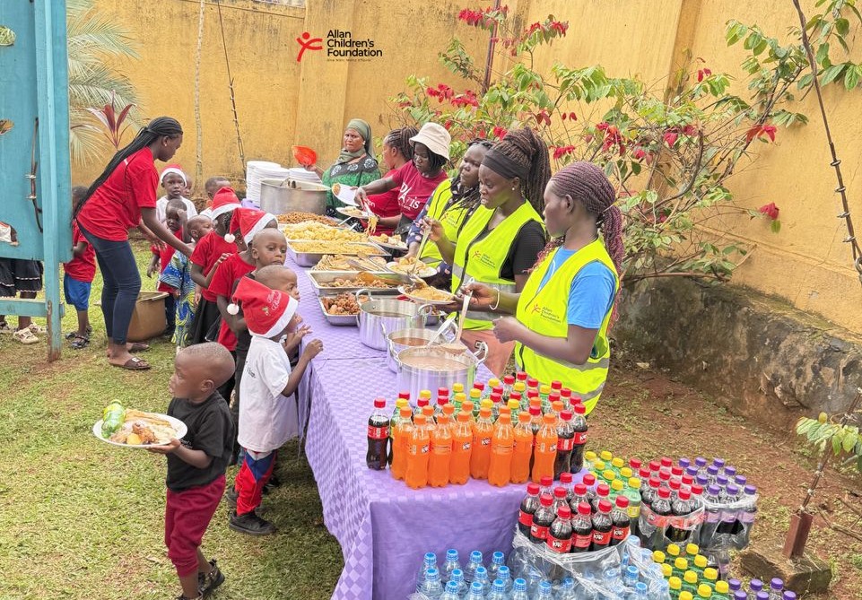 Children gathered around the Christmas table sharing a festive meal together